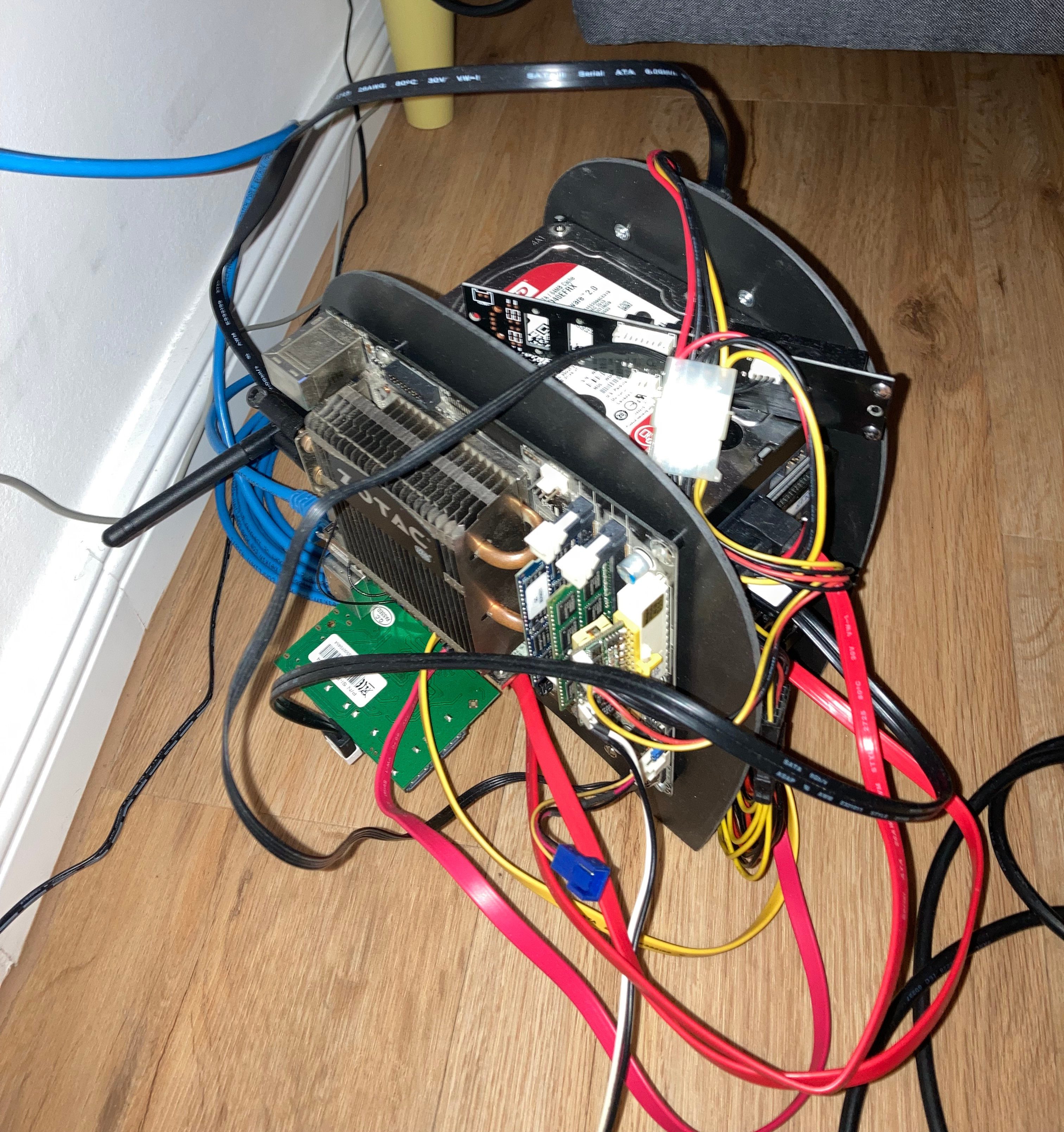 The assembled server standing on the floor, with cables sticking out all around it